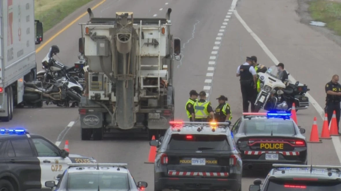 Toronto officer in hospital after Hwy. 403 collision between police motorcycle, tractor trailer