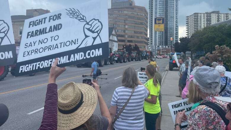 Dozens of tractors roll into Kitchener in protest of Wilmot farmland deal