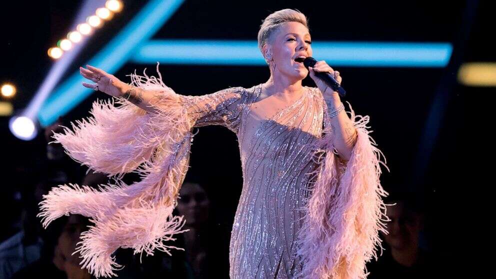 Watch Pink's touching performance in honor of Olivia Newton-John at the AMAsShe sang Newton-John's hit 