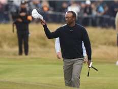 Tiger Woods flames out at Royal Troon, but vows British Open return