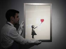 Two men charged with stealing famous Banksy image from London art gallery