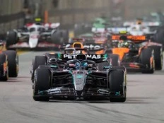 George Russell wins F1’s Singapore GP as McLaren secures constructors’ title
