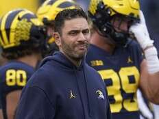 Former NFL, Michigan coach charged with hacking athlete’s intimate photos