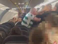 Unruly passenger punches airline crew, cops in scene caught on video