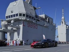 Italian man in Ferrari supercar aims for record run on aircraft carrier
