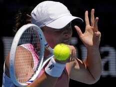 Australian Open: Iga Swiatek is in total control during a 6-1, 6-0 rout of Emma Raducanu