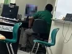 U.S. high school football coach caught watching porn in front of students