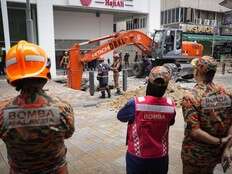 Woman plunges into 8-meter deep hole after pavement sinks in Malaysia