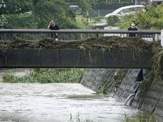 Slow tropical storm dumps heavy rain around Tokyo after causing floods in southern Japan