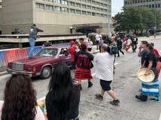 Driver confronted after car driven through protest against police in Winnipeg