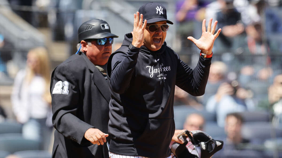 Hot mic catches Aaron Boone-umpire interaction after unusual ejection in A's-Yankees game