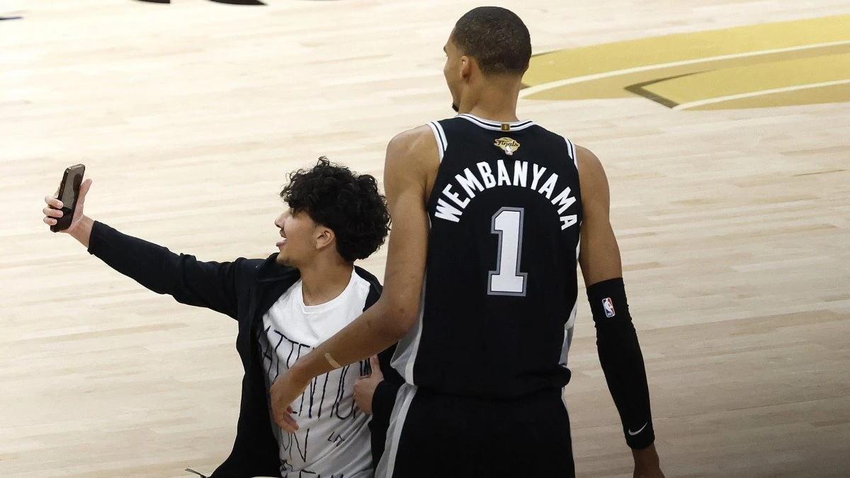 NBA bans fan for life after running onto court to attempt selfie with Wembanyama