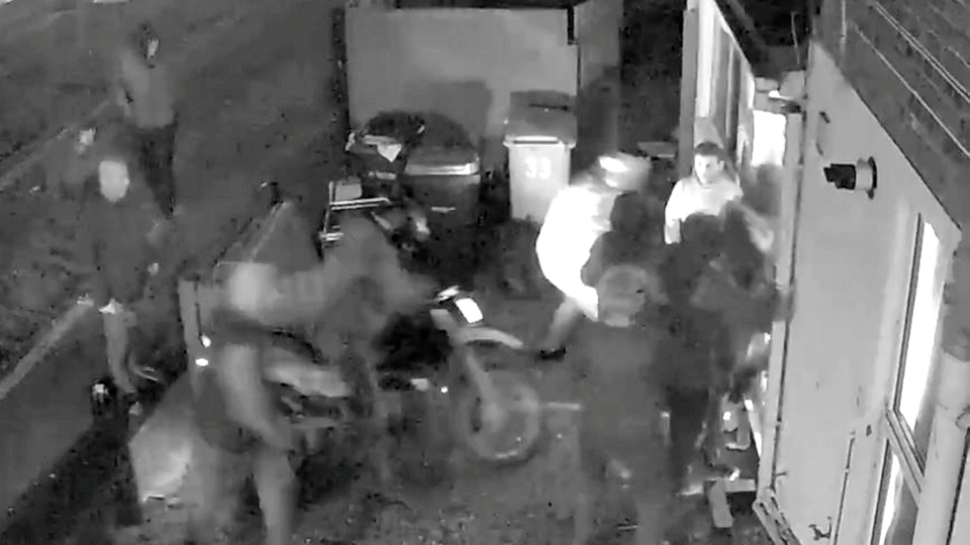 Terrifying moment gang storm house after smashing down door with motorbike