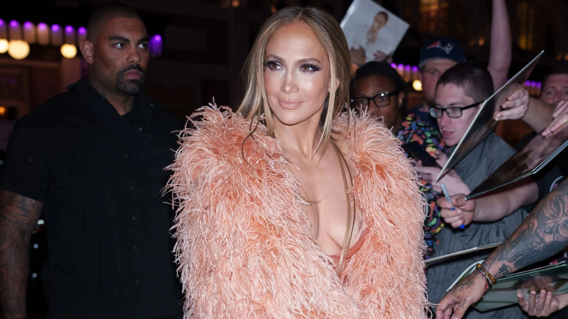 Braless J-Lo wows in plunging satin dress before changing into white gown