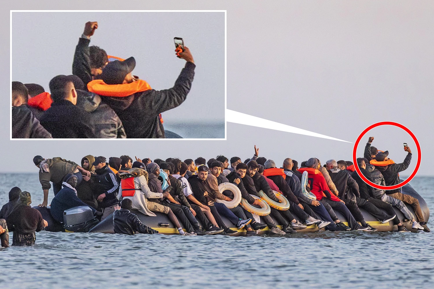 Migrants celebrate & take selfies on dinghy as they dodge cops to cross Channel