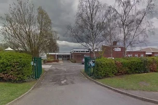 Schools plunged into lockdown as armed cops hunt for 'man with machete'