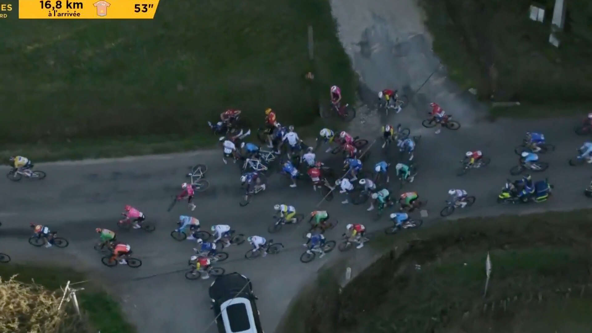 Cycling race comes close to disaster as car turns on to course with big crash