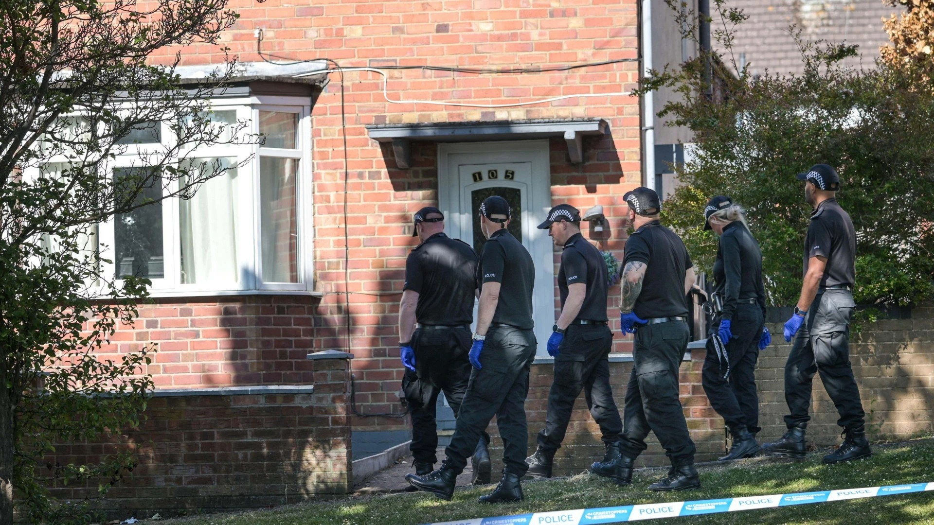 Woman rushed to hospital after being shot at home as cops hunt for gunman