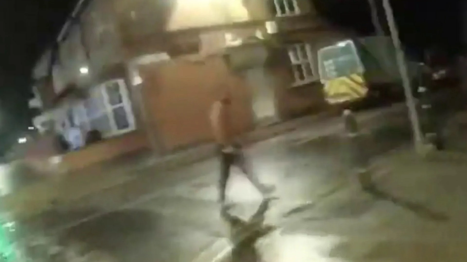 Moment topless knifeman lunges at cops with blade after biting man's EAR off