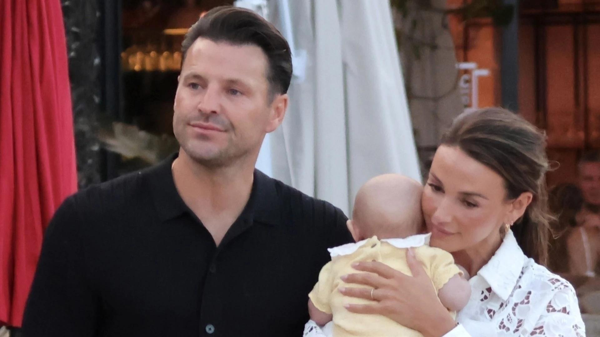 Michelle Keegan cradles baby Palma on birthday day out with Mark in Spain