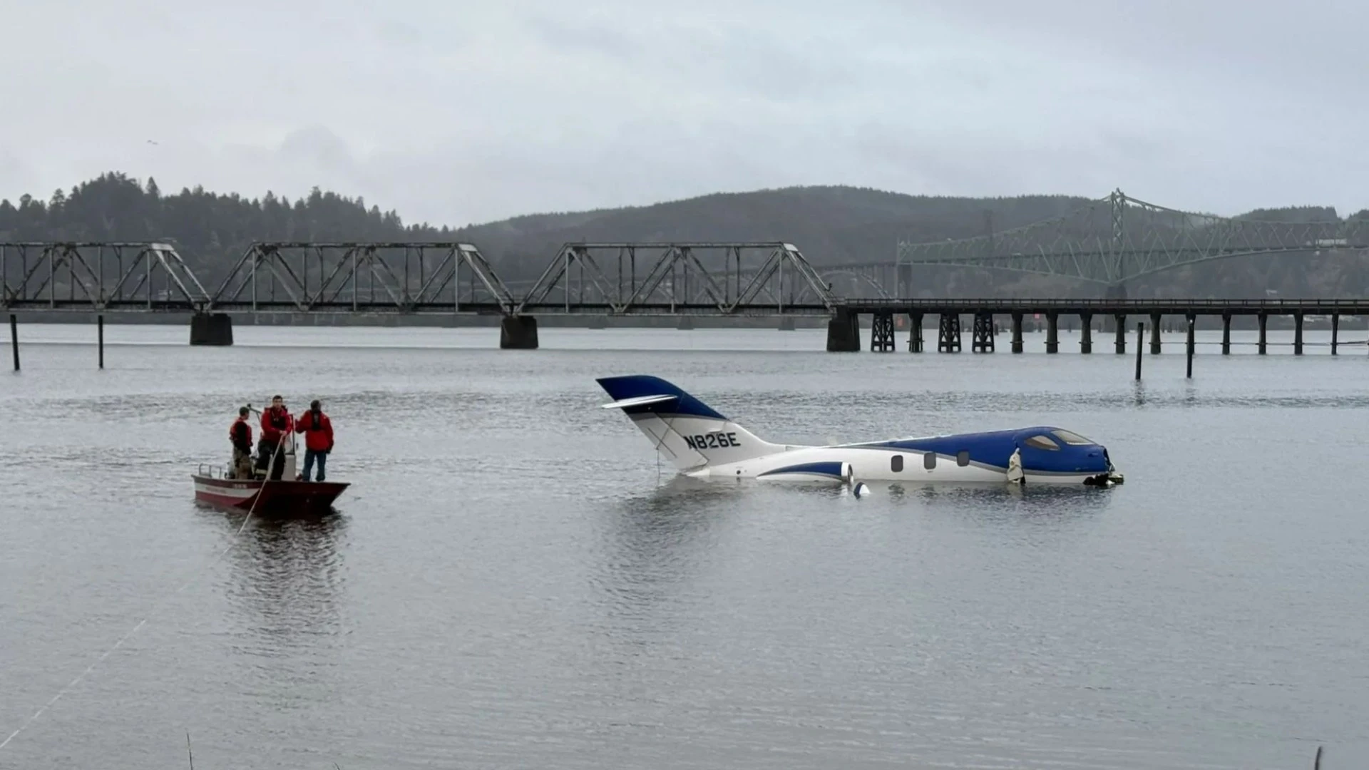 Plane skids off airport runway and splashes down on river in horror landing