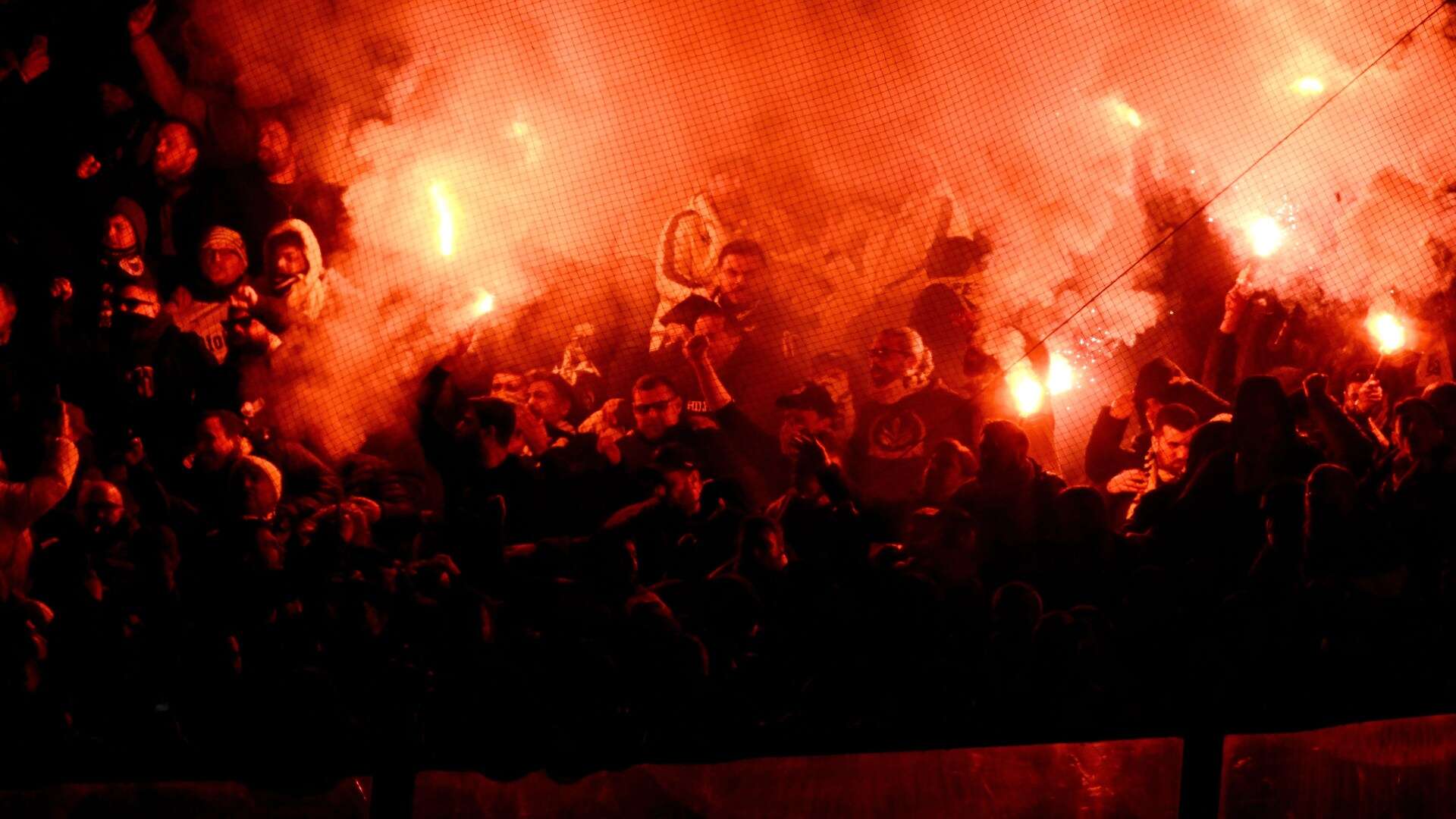 Istanbul derby suspended as Fenerbahce fans throw flares into Galatasaray end