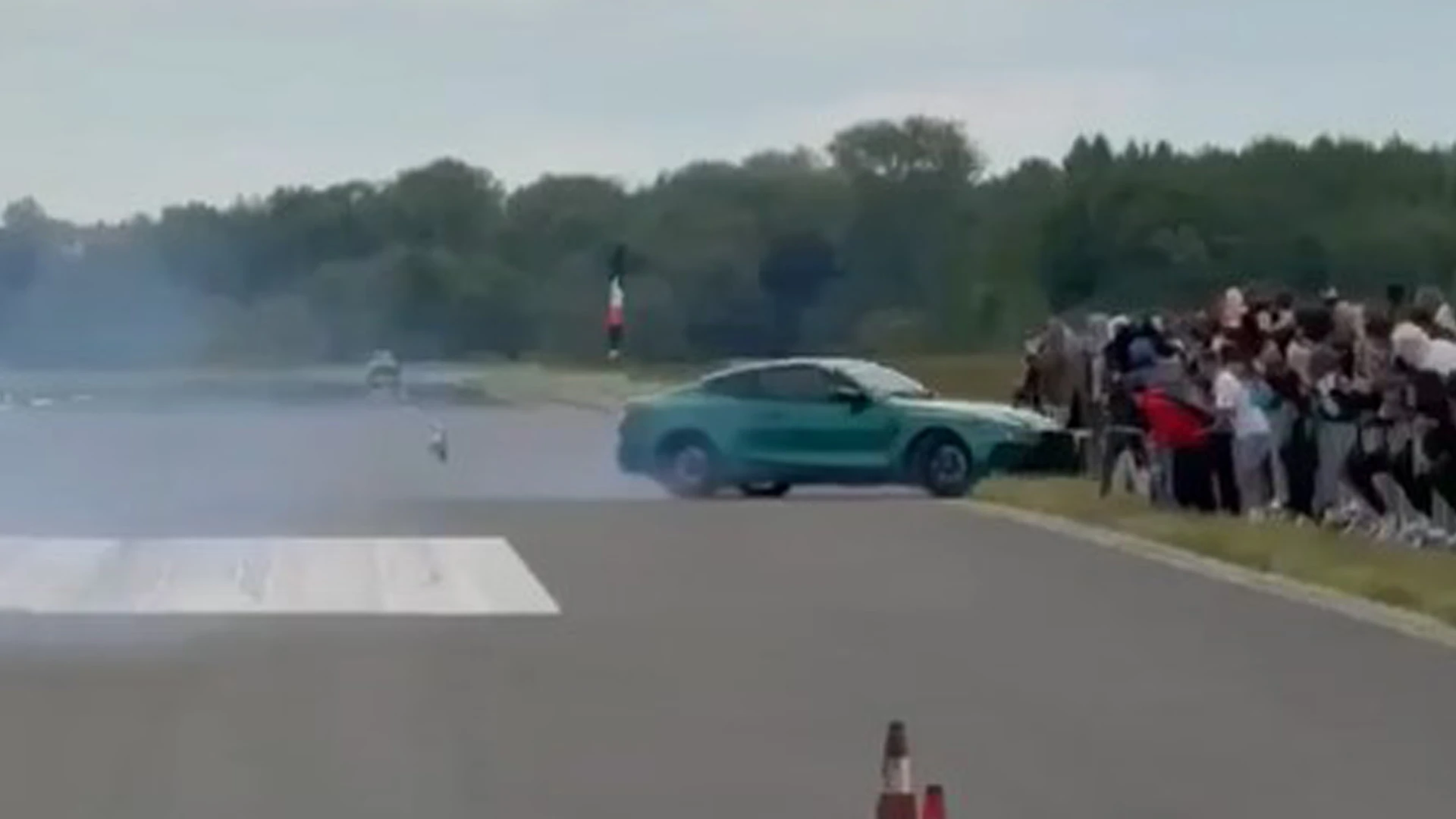 Horror moment car crashes into crowd of spectators at drag racing event
