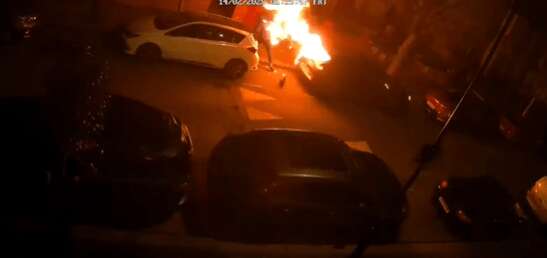 Moment man sparks car blaze with lighter - but mistakenly sets HIMSELF alight