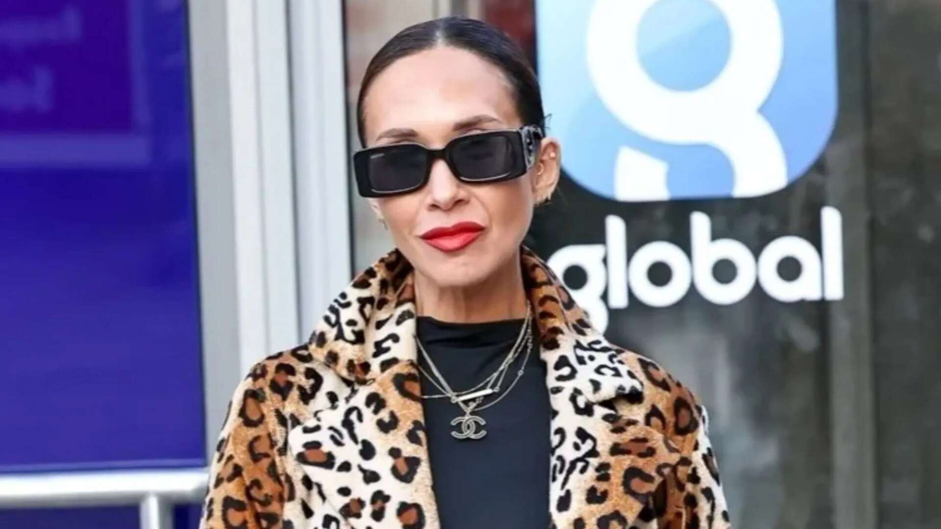 Myleene Klass shows off long legs in black hotpants & leopard print coat