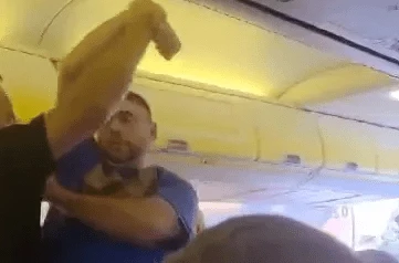 Dramatic moment armed cops drag boozy Brit stag do louts off Ryanair jet