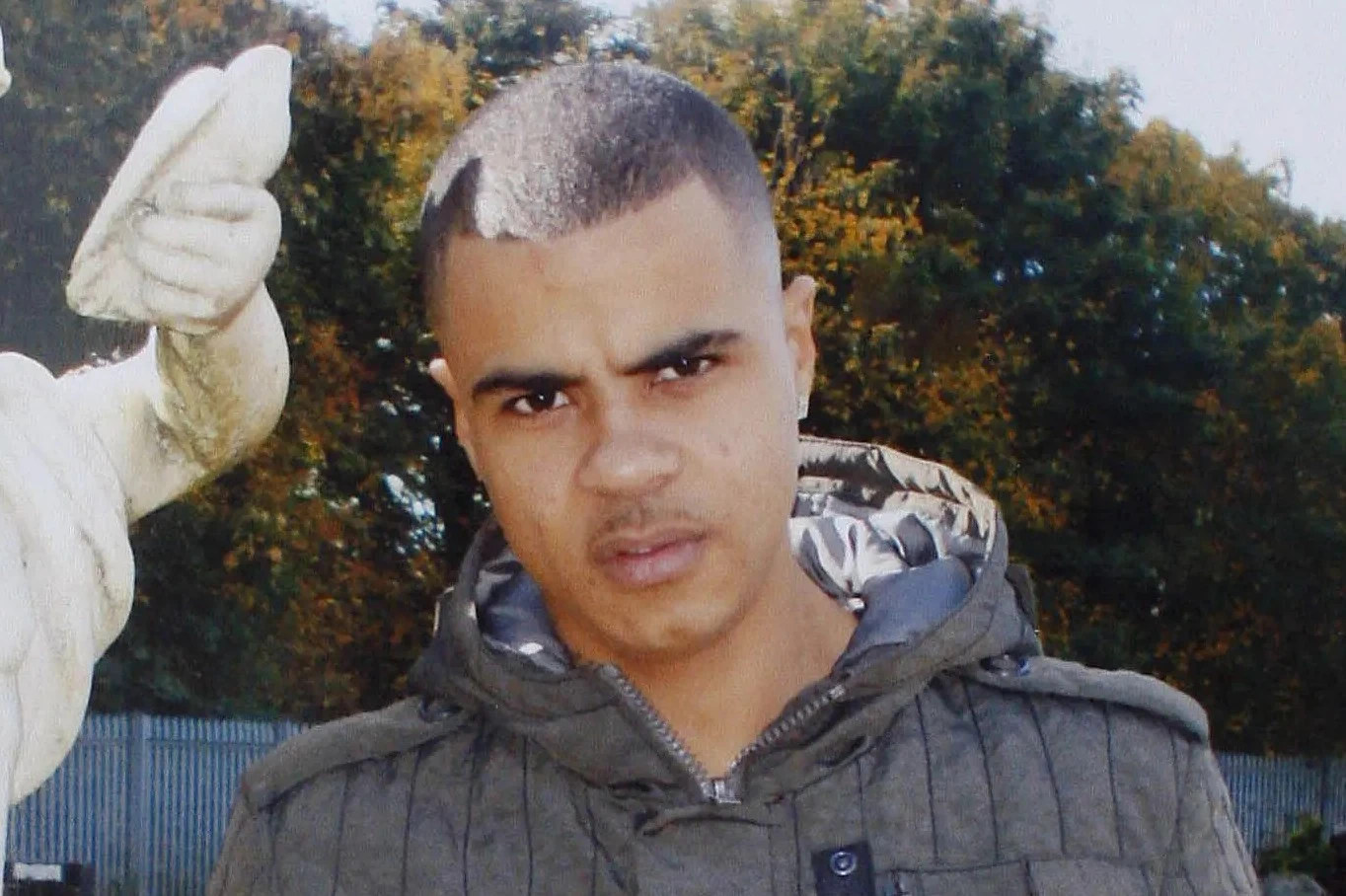 Son of man whose police death sparked 2011 riots charged with possessing a gun