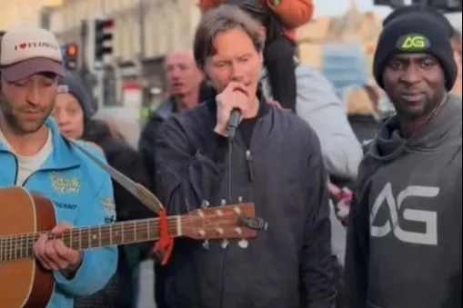 Pop star with huge hit unrecognisable as he performs in the street