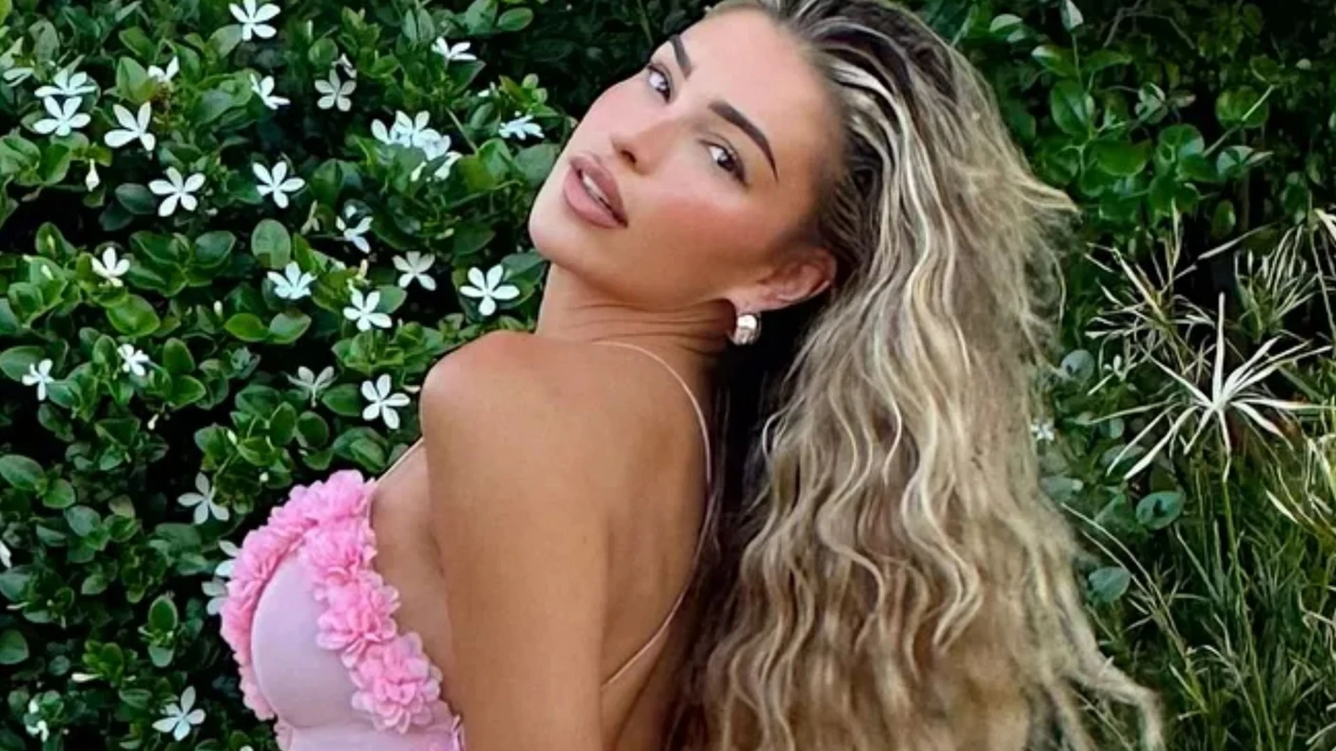 Zara McDermott stuns in backless pink dress during Ibiza break