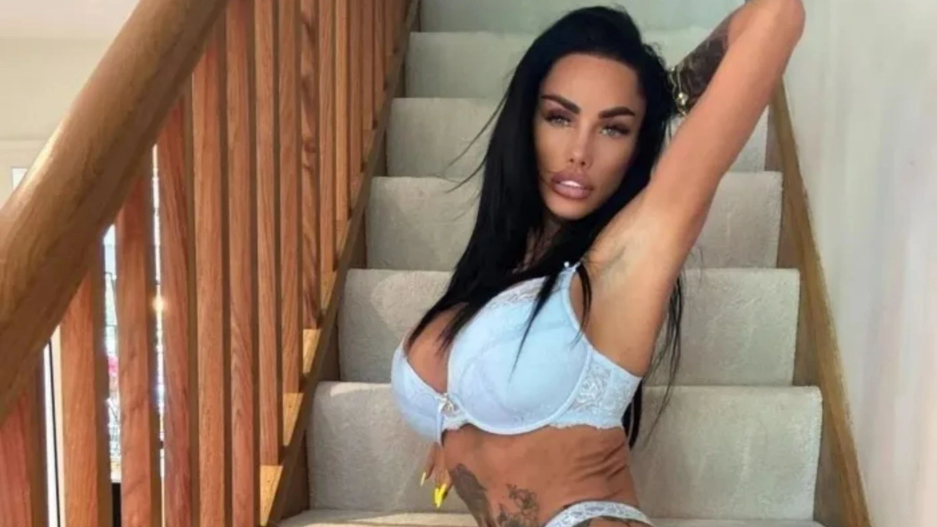 Katie Price shows off her shrinking frame as she poses on stairs in racy shoot