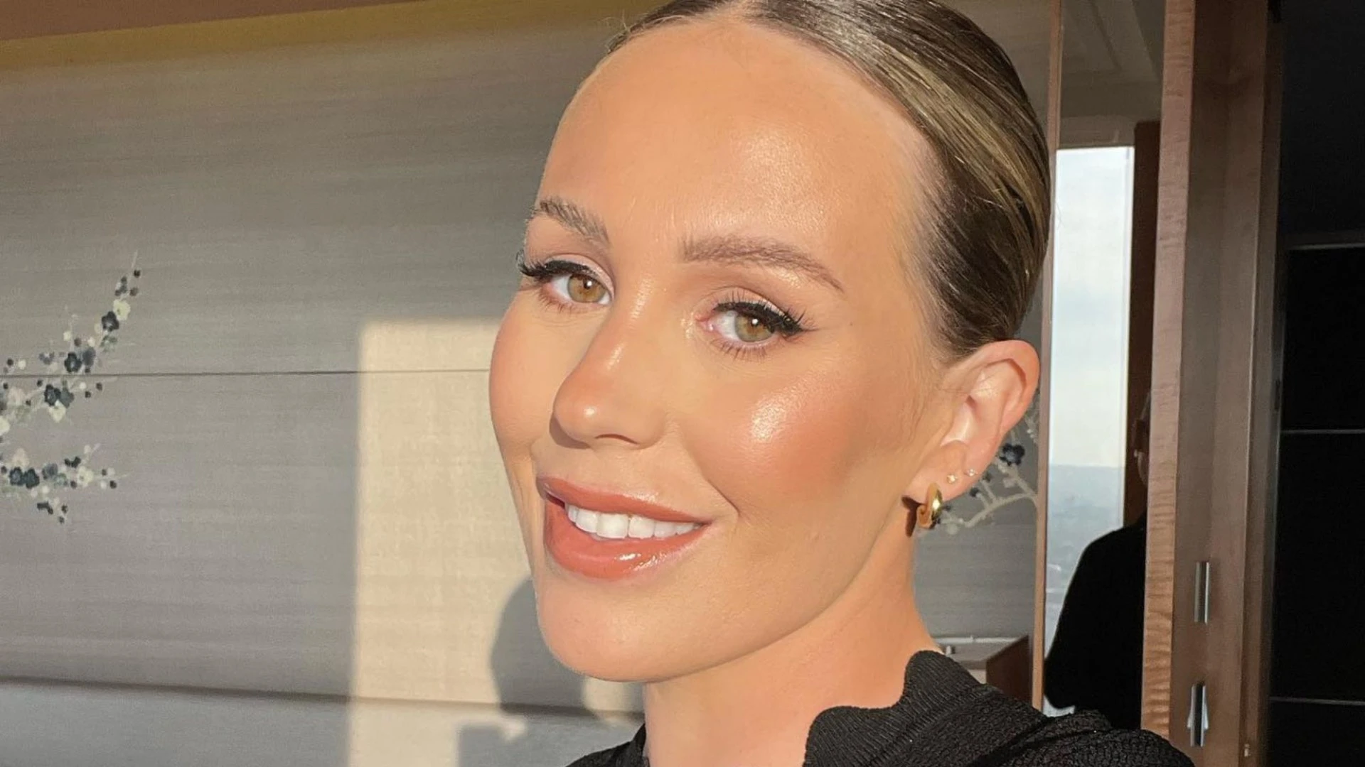Proud stepmum Kate Ferdinand shares rare family snap as stepson TOWERS over her
