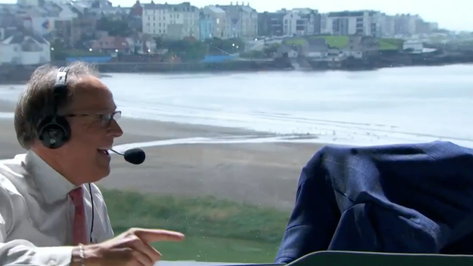 Moment The Open commentator hides under his jacket as BAT invades booth