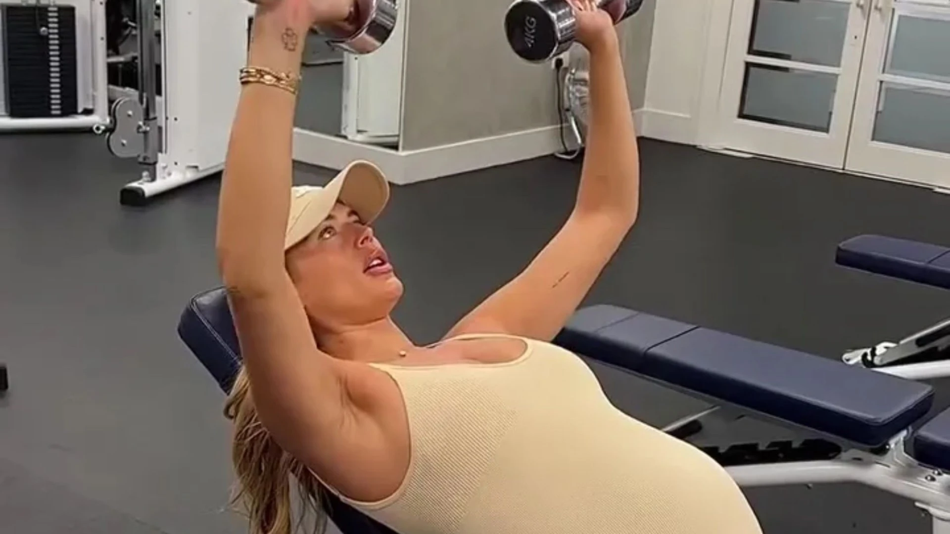 Pregnant Love Island star Arabella Chi shows off huge bump as she lifts weights