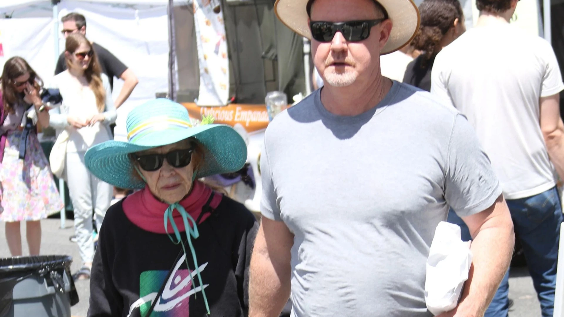 Comedy icon, 91, holds hands with younger man - can you guess who she is?