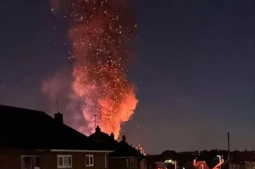 Huge blaze rises over residential street with plumes of smoke seen for miles