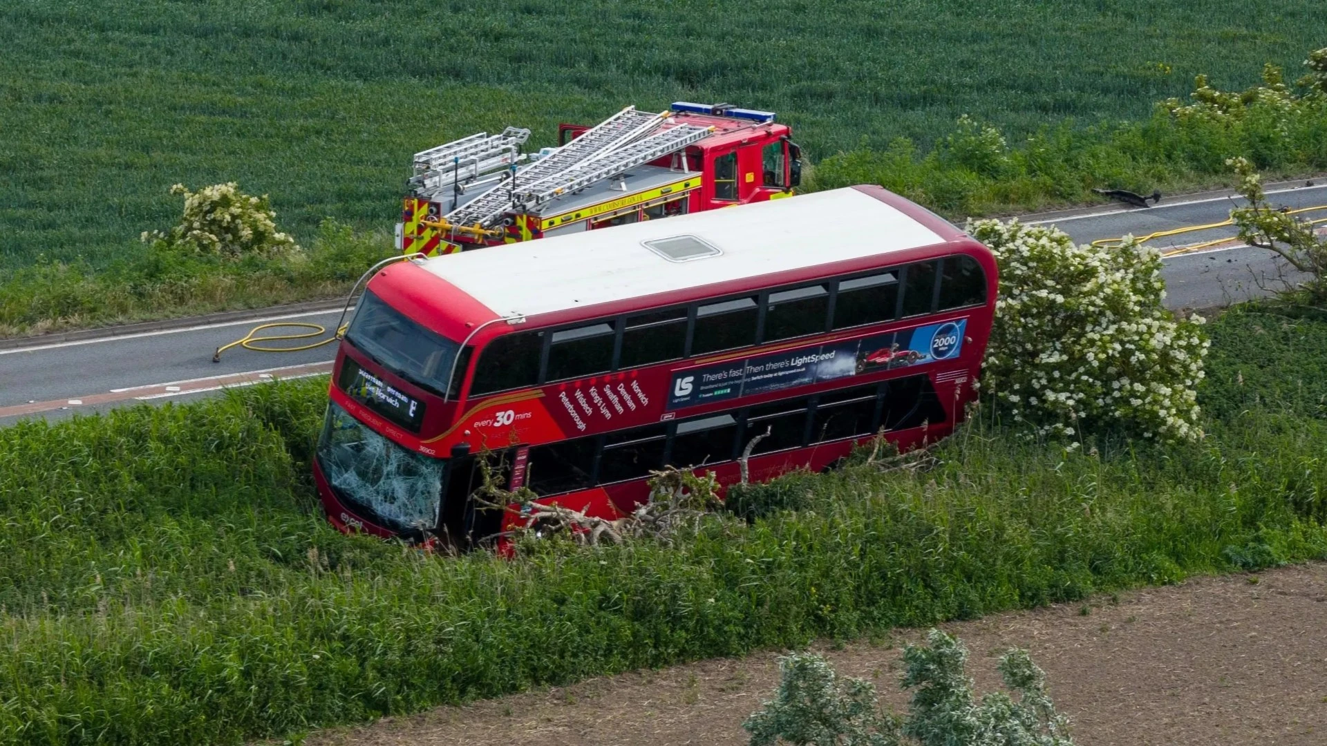 Driver dies after car and double-decker bus collide in crash on major road
