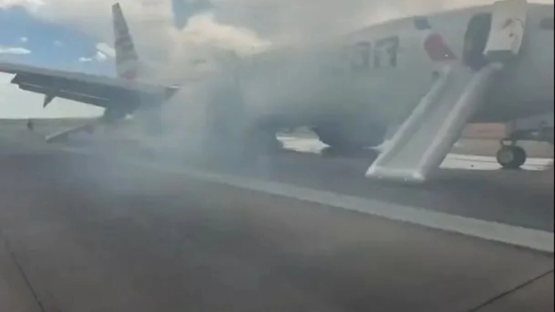 Moment 150 passengers flee plane engulfed in smoke after fault sparked fire