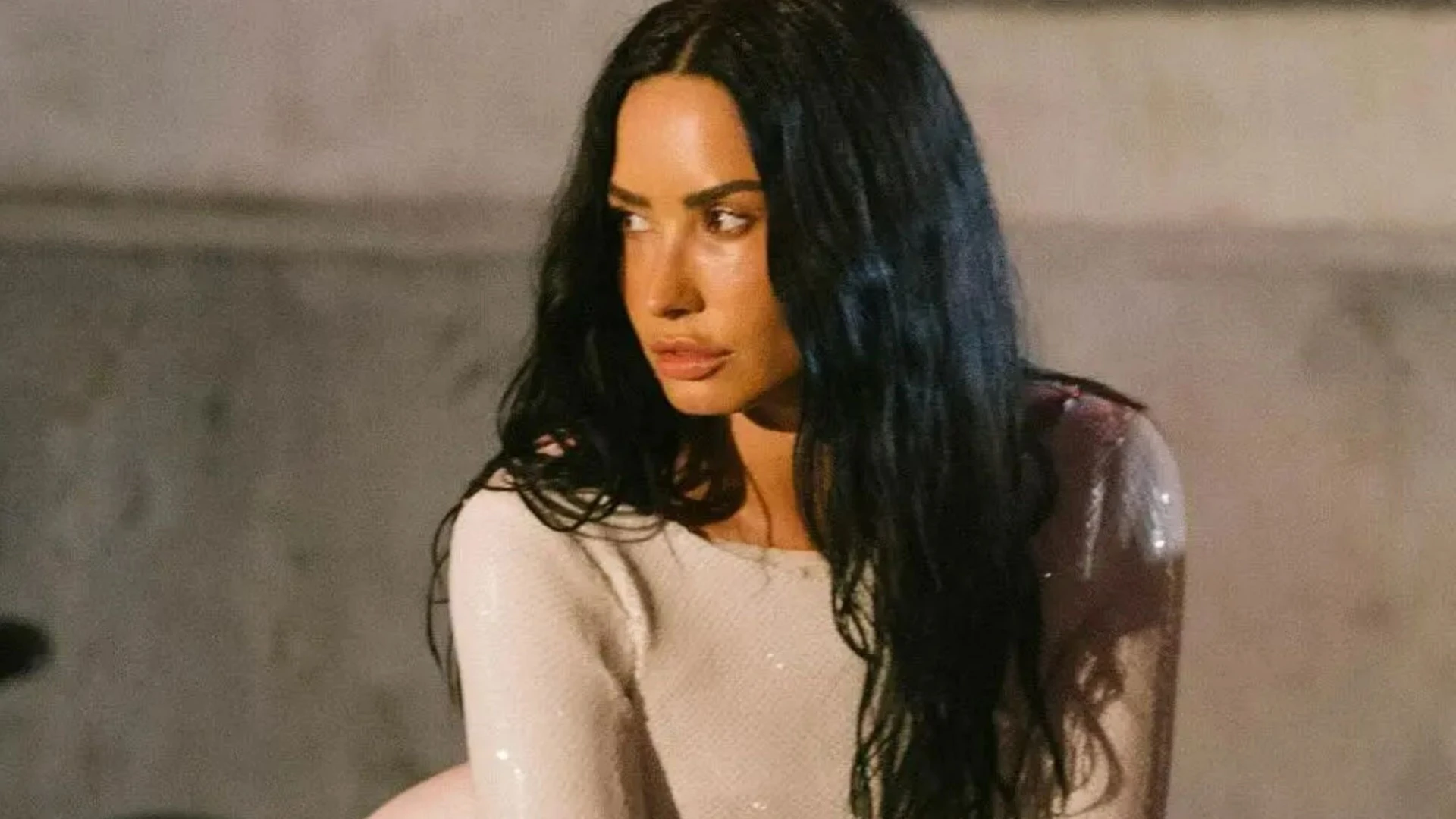 Demi Lovato channels Kim Kardashian in white mini-dress to film new music video