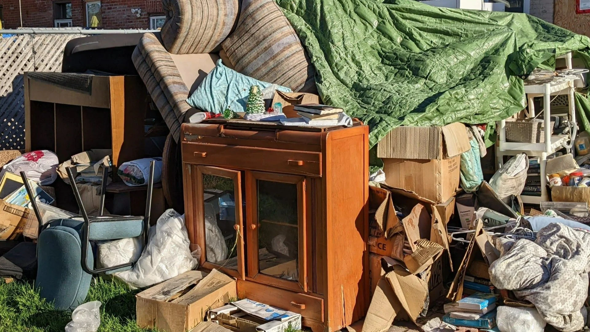 My neighbour won’t move his 'fire hazard' waste mountain from our shared garden
