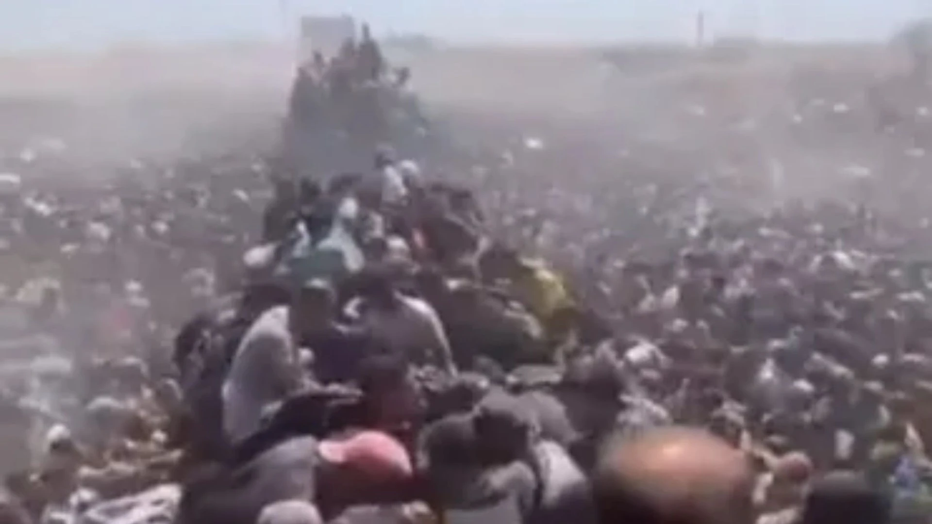Harrowing moment desperate Gazans overrun aid trucks as Israel halts strikes