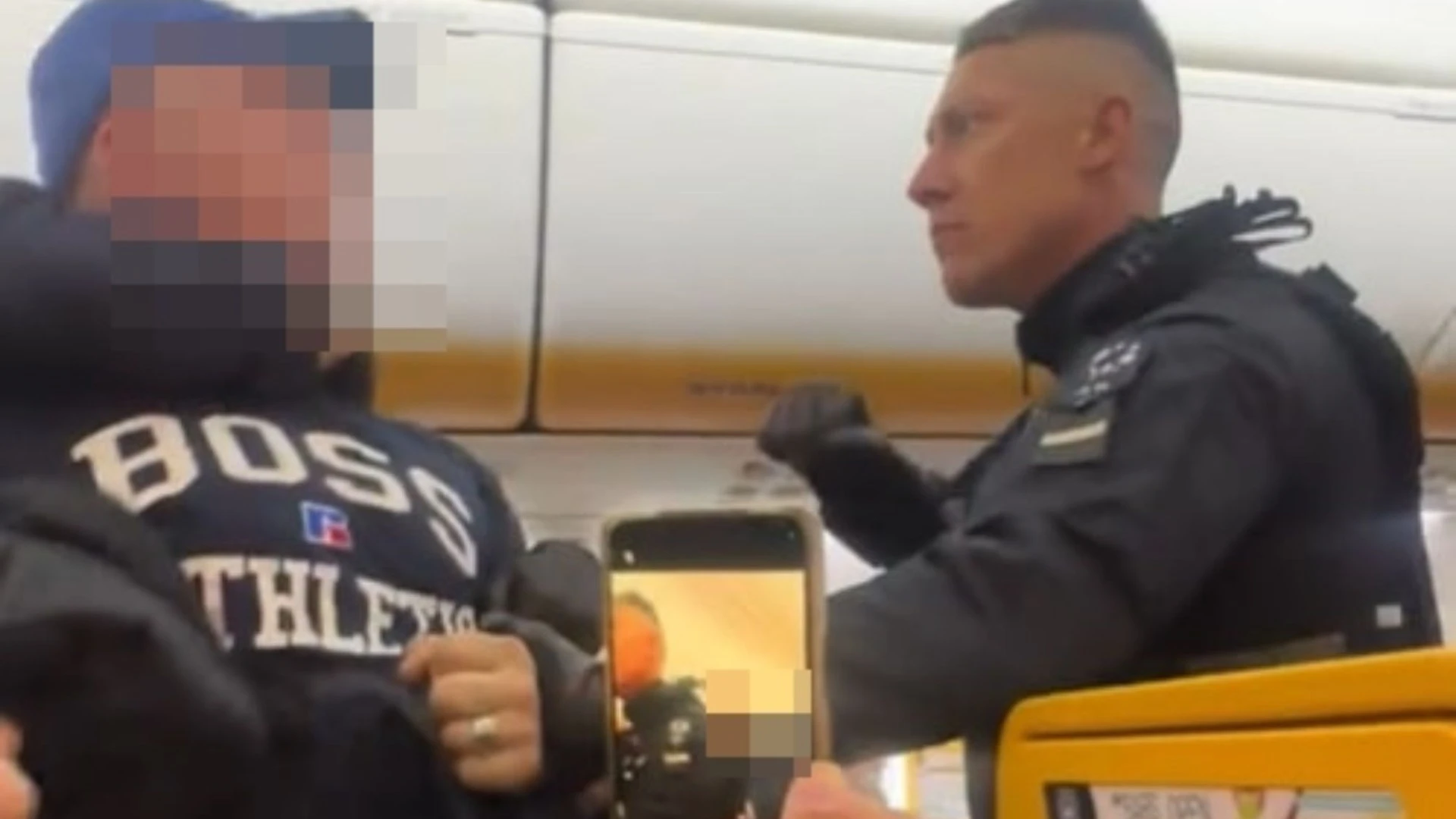 Shock moment armed cops drag Brit stag do yobs off flight after emergency landing