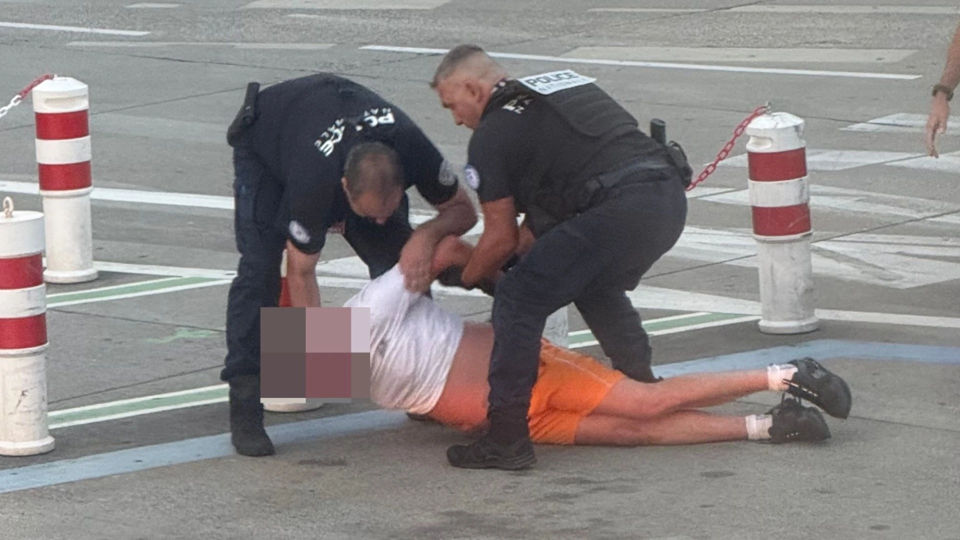 Moment drunk passenger is dragged off plane after trying to open door mid-air