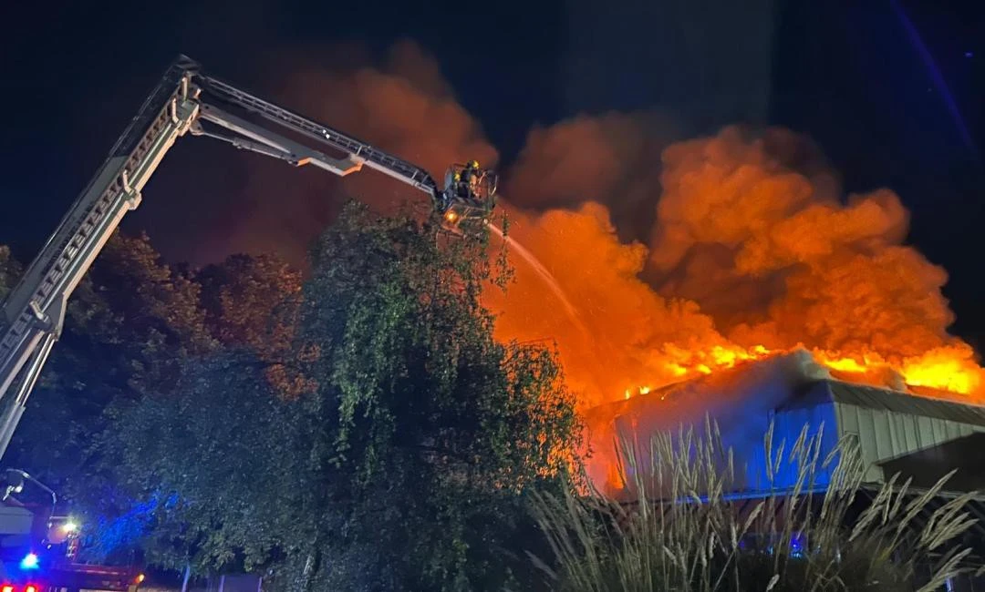 Huge blaze rips through football ground sending smoke billowing into sky