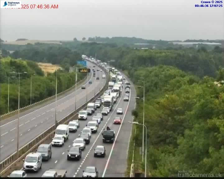 Major motorway closed after lorry overturns as drivers hit with 2-hour delays