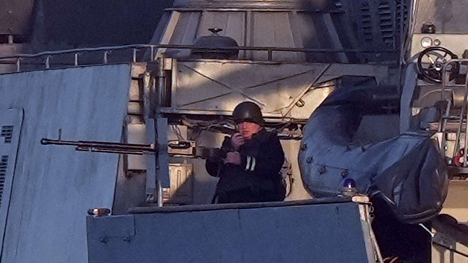 Chilling pics show Putin crew ready to ATTACK as warship passes through Channel