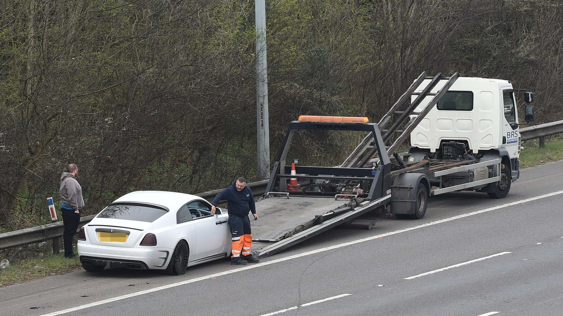 Moment Marcus Rashford's £700k Rolls-Royce is towed off on M60 after tyre blew out